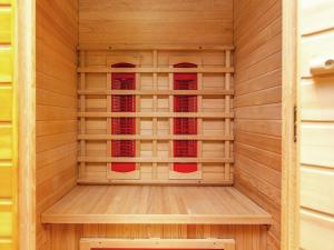 a sauna with wood paneling and a sauna at Wellness Escape in Bellevaux in Malmedy