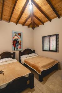 Postel nebo postele na pokoji v ubytování Monteverde