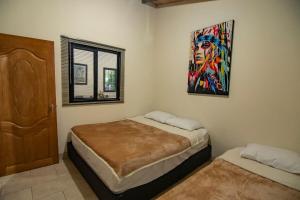 Postel nebo postele na pokoji v ubytování Monteverde