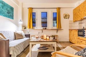 a living room with a couch and a table at Downtown Central Suite with Private Parking in Kalamata