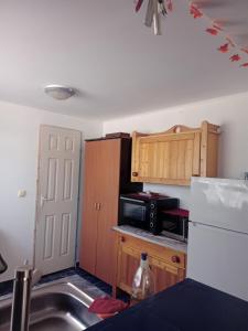 Kuchyň nebo kuchyňský kout v ubytování Cabana Dori