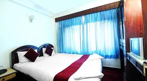 Postel nebo postele na pokoji v ubytování Hotel Lily