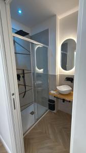 a bathroom with a sink and a mirror at Ulivo Guest House Roma in Rome +38 photos