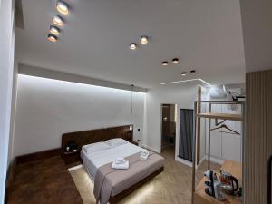 a bedroom with a bed and a mirror at Ulivo Guest House Roma in Rome
