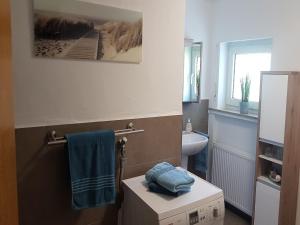 a bathroom with a box in the corner of a room at Gemütliche Wohnung für 4 Personen in Medebach