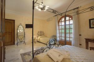 Ένα ή περισσότερα κρεβάτια σε δωμάτιο στο Villa Diana