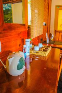 a kitchen counter with a appliance on top of it at Bamboo Cabana Ella by Hill crest in Ella