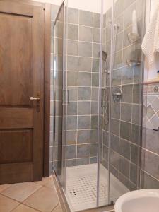 a shower with a glass door in a bathroom at Chic Casa al Mare in Basilicata in Marina di Pisticci