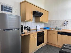 Η κουζίνα ή μικρή κουζίνα στο Blunest Apartment 3