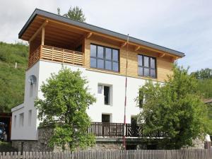 a house with a wooden roof at Holiday Home in Wenns near Ski Lift in Wenns