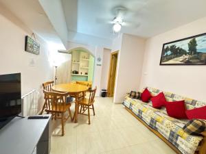 a living room with a couch and a table at ADA & Gran Alacant & Vacation in Gran Alacant
