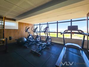 a gym with three cardio bikes in a room at Residencial Premium Stella Maris by VLV Stays in Salvador