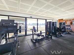 a gym with treadmills and machines in a building at Residencial Premium Stella Maris by VLV Stays in Salvador +37 photos
