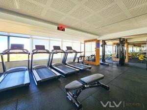 a gym with several treadmills and cardio machines at Residencial Premium Stella Maris by VLV Stays in Salvador