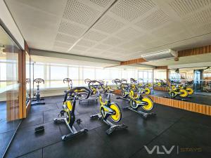 a gym with rows of exercise bikes in a room at Residencial Premium Stella Maris by VLV Stays in Salvador