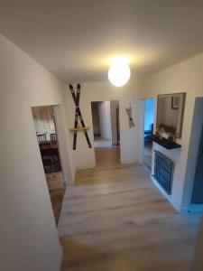 a hallway of a house with a light on the ceiling at Mountain View 3 Bedroom Apartment Saint Beat Lez in Saint-Béat +2 photos