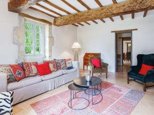 a living room with a couch and a table at Holiday Home Dunes with Private Pool in Dunes +34 photos
