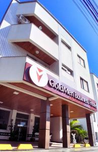 a building with a global investment firm sign on it at Goldmen Business Criciúma in Criciúma