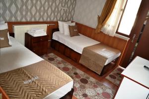 Кровать или кровати в номере Aspawa Hotel