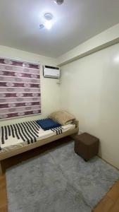 Ένα ή περισσότερα κρεβάτια σε δωμάτιο στο Budget-friendly Unit