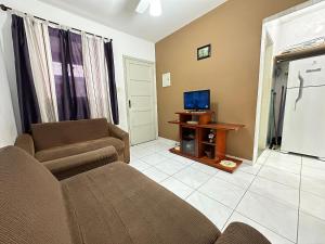 TV a/nebo společenská místnost v ubytování 1 Dorm Pé na Areia – Praia Guilhermina