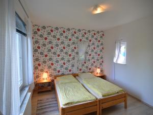 Ένα ή περισσότερα κρεβάτια σε δωμάτιο στο Schönow Forest Apartment