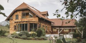 a large wooden house with at Ferienholzhaus in Sankt Gallen im Gesäuse in der Steiermark in Sankt Gallen