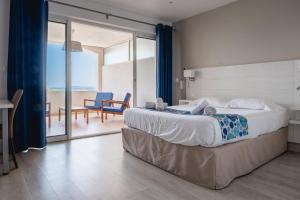 Giường trong phòng chung tại Hôtel Beau Site