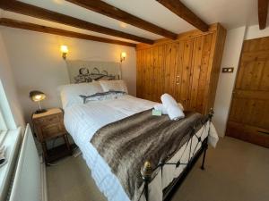 Postel nebo postele na pokoji v ubytování Cliff Crest Cottage