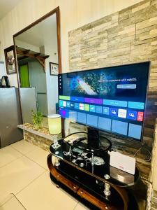 a computer monitor sitting on a table in a room at Studio Nami - Horizons 101 in Cebu City