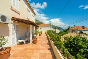 a patio in a house with plants on it at Central Apartment in Dubrovnik