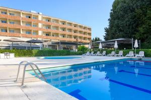 a swimming pool in front of a hotel at Crowne Plaza Rome St. Peter's by IHG in Rome