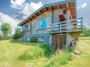 a large wooden house with a gate in front of it at Quaint Chalet, Bernister in Malmedy +48 photos