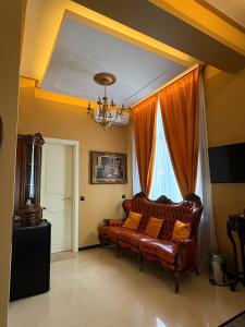 a living room with a couch and a window at La Casa Boutique in Kostinbrod