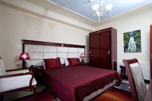 Postel nebo postele na pokoji v ubytování Orchidea Hotel