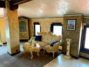 a living room with a couch and a table at La Casa Boutique in Kostinbrod