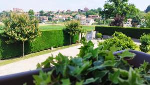 a view of a garden from a balcony at Country Relais Villa Margherita in Pralormo