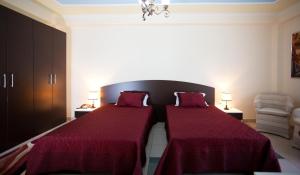 Postel nebo postele na pokoji v ubytování Orchidea Hotel