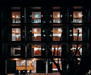 an apartment building at night with lights at Valley Palm Seaview in Guraidhoo