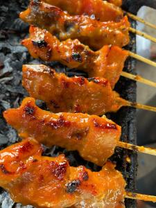 a group of food cooking on a grill at Green Merta in Padangbai +25 photos