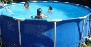 a group of people in a swimming pool at Maison CAILLE in Embrun