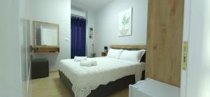 Ένα ή περισσότερα κρεβάτια σε δωμάτιο στο Guesthouse Mecani