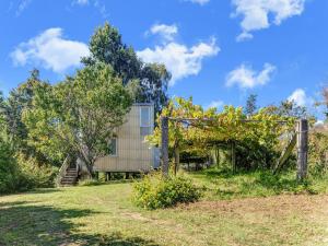 a house on a hill with a fence at Treehouse in Galicia near Silgar Beach in Sanxenxo