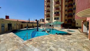 a swimming pool in the middle of a building at Splendor Thermas in Caldas Novas