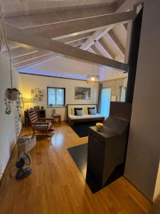 a living room with a couch and a table at Il Cottage in Bellinzona