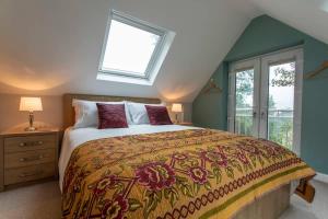 a bedroom with a large bed and a window at Abbey Rectory - with private parking in Bath