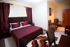 Postel nebo postele na pokoji v ubytování Orchidea Hotel