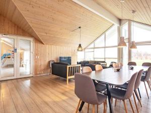 a dining room with a table and chairs at 5 star holiday home in Højslev in Sundstrup