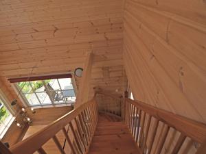 a staircase in a cabin with wooden walls and ceilings at Naturrefugium bei Willingen in Medebach +32 photos