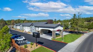 an aerial view of a hotel with a parking lot at voco Flagstaff by IHG in Flagstaff